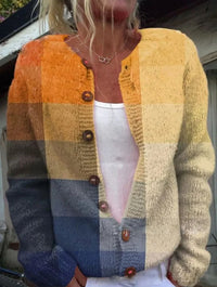 Bedrukt gebreid dames vest met kleurvlakken in geel en blauw, met ronde hals en knoopsluiting