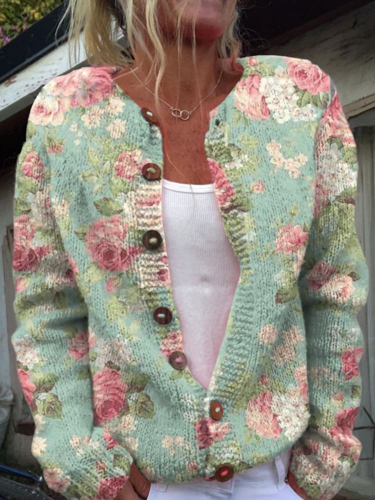 Bedrukt gebreid dames vest met roze rozen op mintgroen, met ronde hals en knoopsluiting