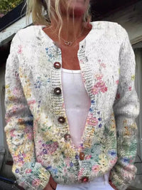 Bedrukt gebreid dames vest met pastelkleurige aquarelbloemen op wit, met ronde hals en knoopsluiting