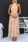 Mouwloze Maxi Jurk met Halterhals, Open Rug en Pastelprint – Zomers & Vrouwelijk – Liliane