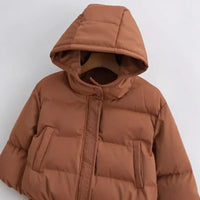 Bruine dames puffer jas met vaste capuchon en ritssluiting