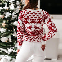 Achterkant van de witte kersttrui met rendieren en sneeuwvlokken