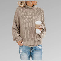 Grofgebreide dames coltrui met ballonmouwen in beige
