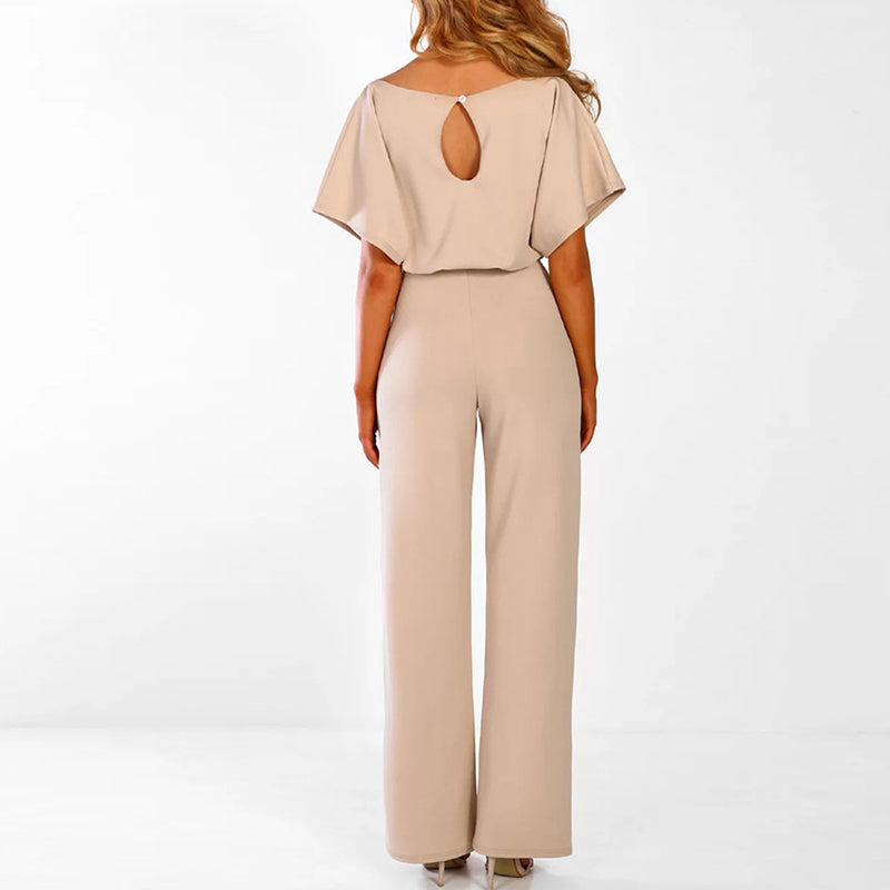 Achterkant van de jumpsuit met vleermuismouwen in beige, met druppelvormige opening in de rug