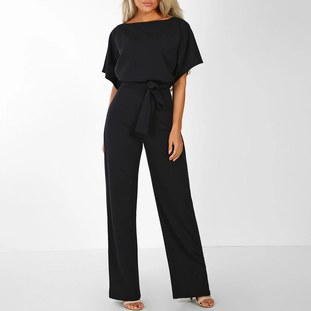 Wijde dames jumpsuit met vleermuismouwen en strikceintuur in zwart