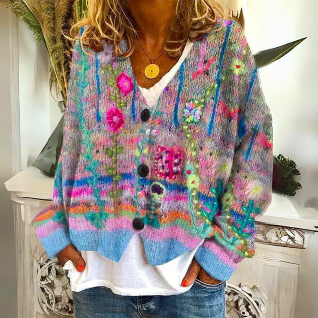Blauw gebreid dames vest met bloemenmotief in borduurlook en knoopsluiting