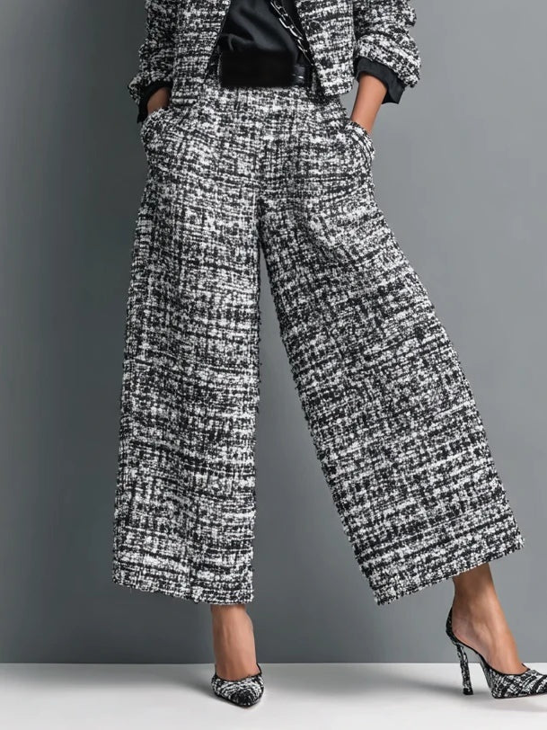 Wijde tweed broek met hoge taille en steekzakken in zwart-wit