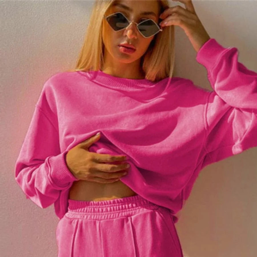 Korte roze sweater met ronde hals en verlaagde schouderlijn