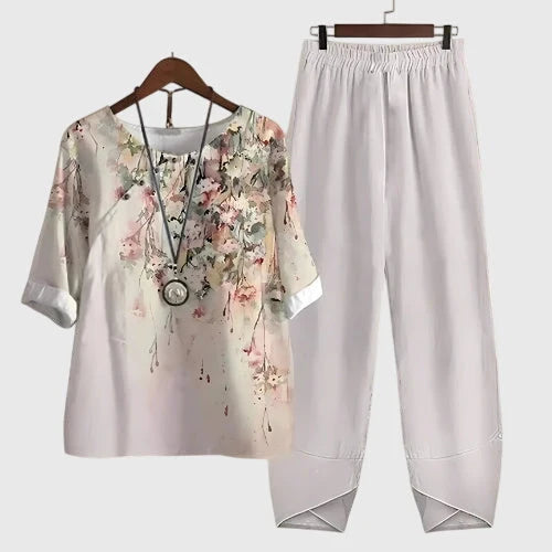 Witte tweedelige set met bedrukte top en losse broek