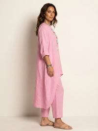Roze tuniekset met broek van opzij