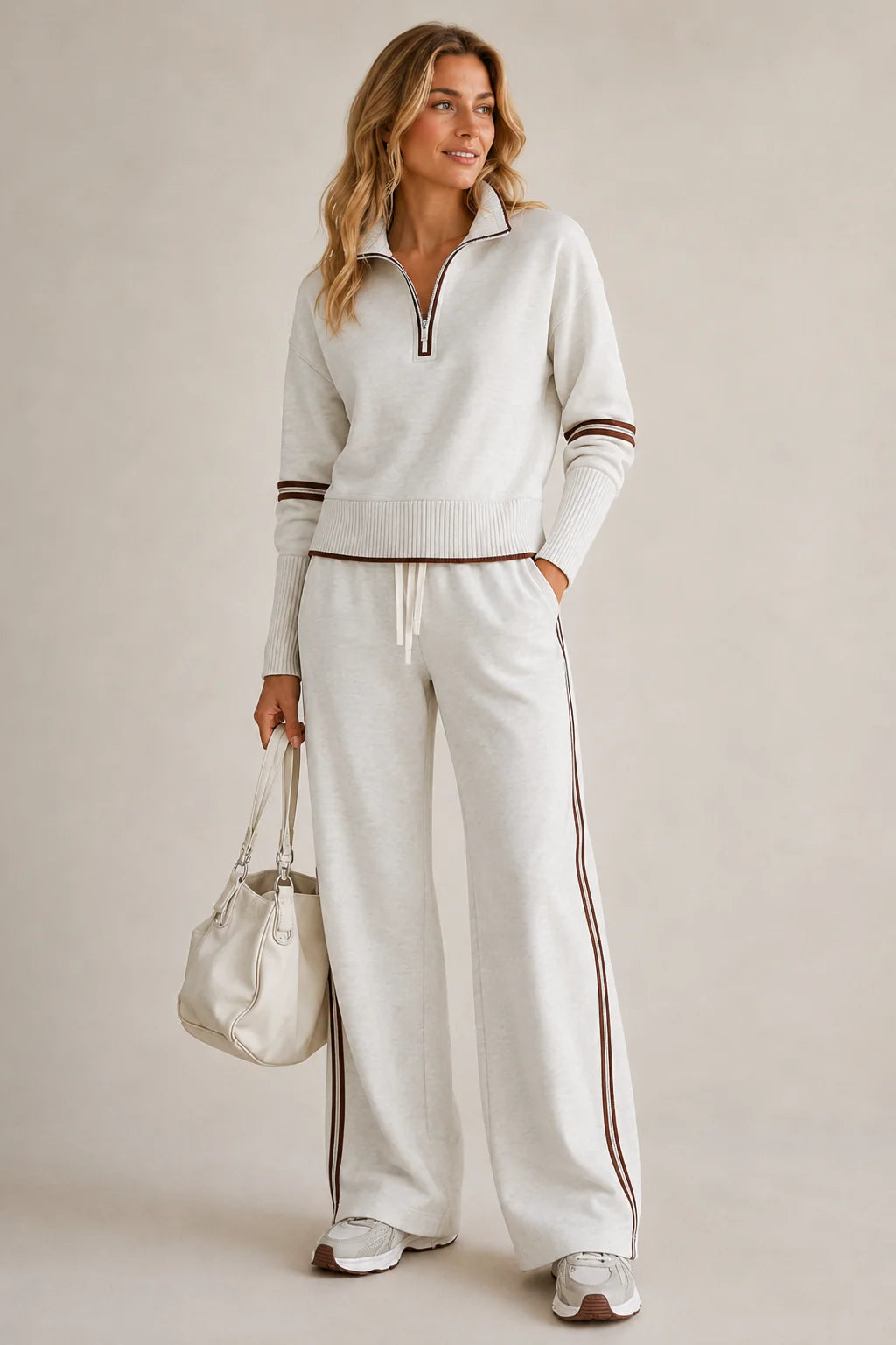 Witte sweaterset dames met kwartrits en wijde broek met contrastbies